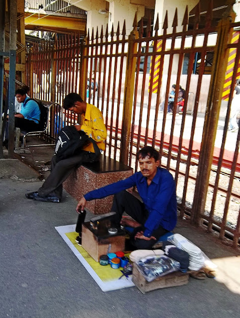 shoeshine man at railway station