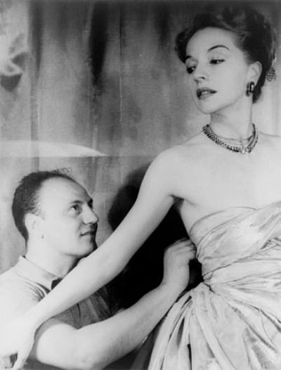 Pierre Balmain fitting a costume for Ruth Ford