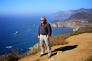 Anders standing on a bluff overlooking the California Coast Line.