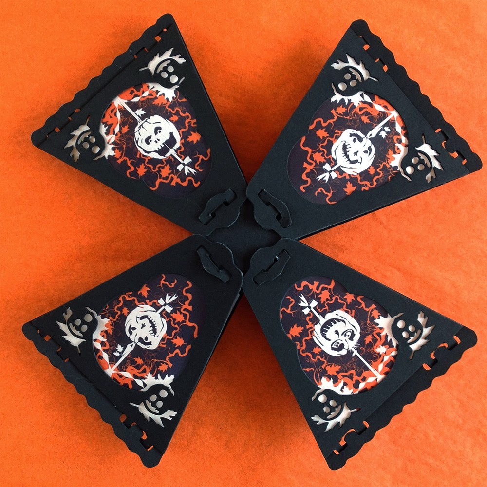 8-sided paper lanterns by Bindlegrim feature 8 Halloween pumpkins in orange and black