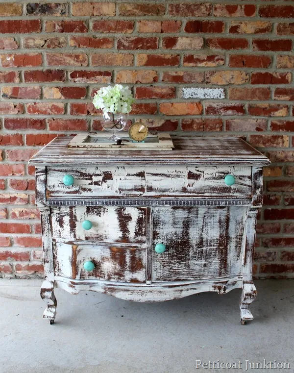 Shabby white distressed dresser by Petticoat Junktion, featured on I Love That Junk. And boy do I love this!