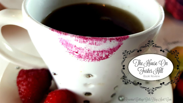 A cup of coffee in a white cup with rhinestones in it and strawberries on the rim and the cup has red lipstick. The text says The House On Foster Hill Book Review by rosevinecottagegirls.com
