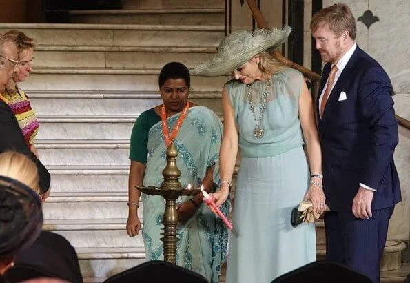Queen Maxima wore Sandro blue ring detail midi dress. Queen Maxima wore a new turquoise green tulle dress by Natan