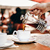 Person Pouring Coffee on White Ceramic Cup