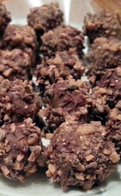 Tasty recipe for peanut butter truffles coated with Graham Cracker crumbs.
