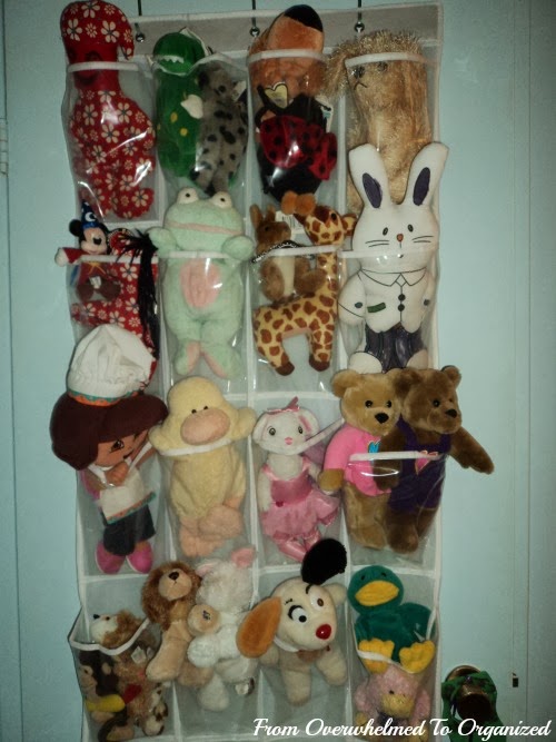 Overdoor shoe bag installed to hold stuffed animals.