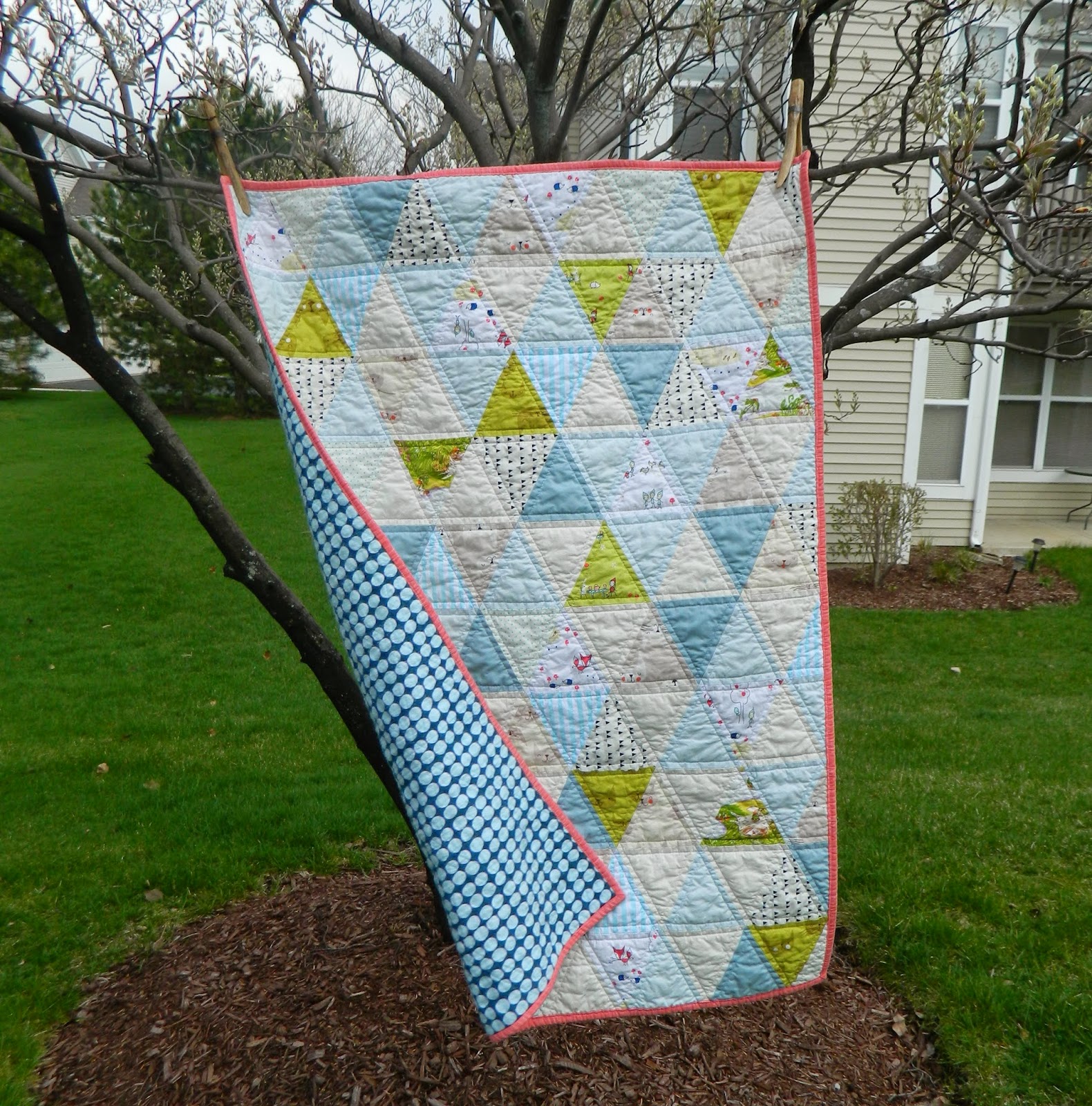 http://sotakhandmade.blogspot.com/2014/04/triangles-finished-baby-quilt.html