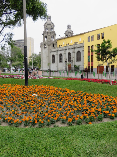 Flowers and the church in Parque Kennedy in the Miraflores District of Lima Peru