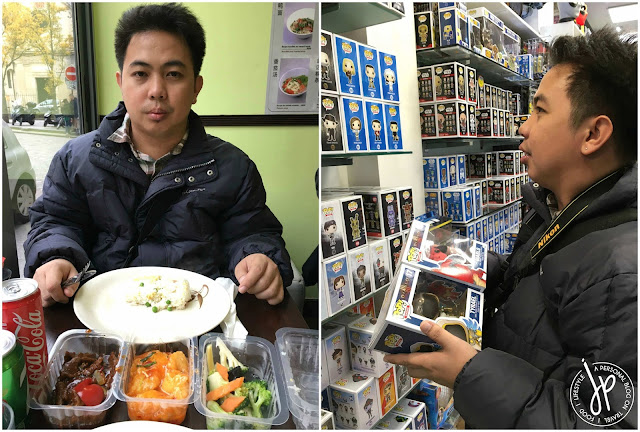 man on table eating, man looking at toys at a toy shop
