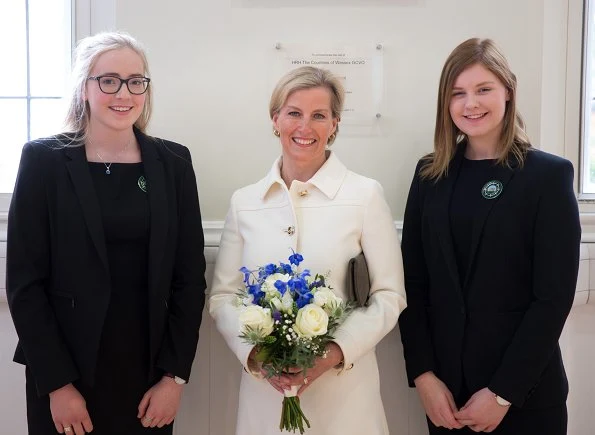 The Countess of Wessex wore Prada Gabardine wool jacket, skirt and suede pointtoe pumps. Sophie Habsburg clutch bag. Gold hoop earrings. Skagen Ladies watch