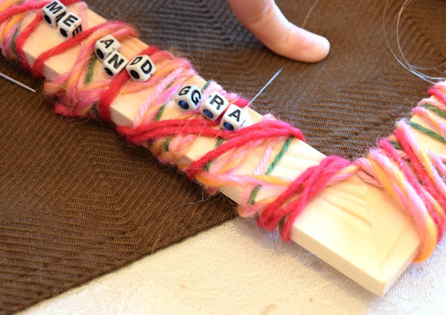 Kid made Mother's Day gift- yarn wrapped picture frames. Fun craft for preschool, kindergarten, or elementary children that makes a great gift for moms or grandmothers.