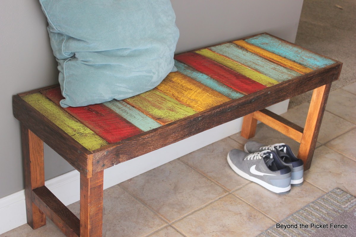 colorful rustic bench made with pallet wood and reclaimed wood http://bec4-beyondthepicketfence.blogspot.com/2014/04/colorful-rustic-bench.html