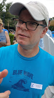 Austin Artist and Writer, David Borden, being hospitable at a swim meet as a member of the prestigious and highly selective Hospitality Committee.