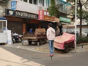 girl on a pogo stick in Changsha