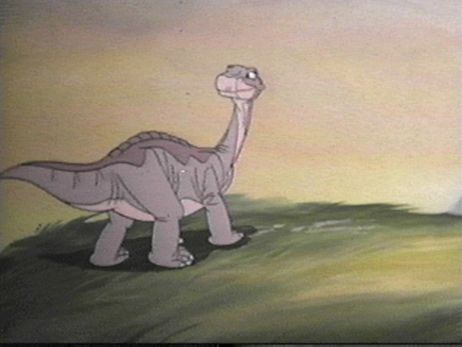dinosaur looking back over its shoulder in The Land Before Time 1988 animatedfilmreviews.filminspector.com