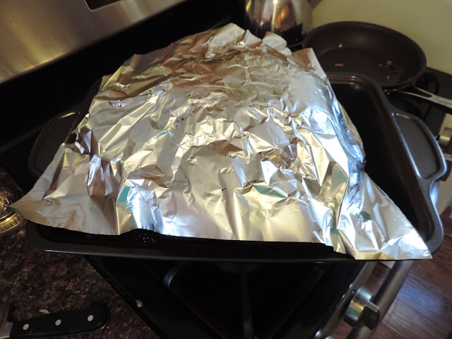 The turkey being covered with foil.