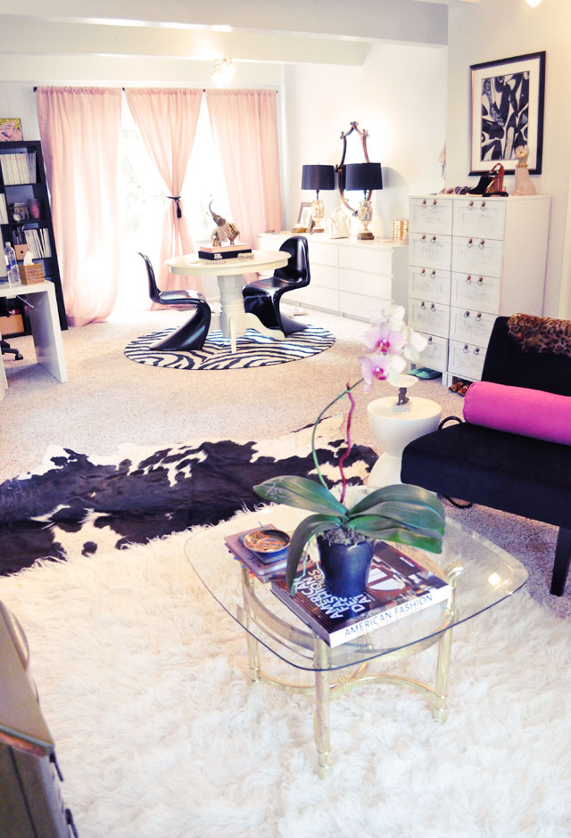 black and white and pink and gold home office and sitting area