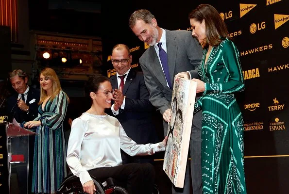 Queen Letizia wore a new scarf-print long dress by Sandro, with Prada pumps for Marca's lunch at Royal Theatre