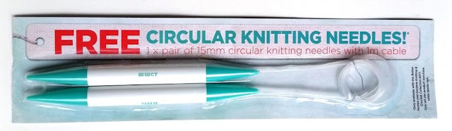 A set of 15 mm plastic circular knitting needles in it's cardboard-backed blister pack. The needles are white with teal coloured points. The cable is clear plastic and coiled in a circle on the right hand side of the package. The label says "FREE Circular Knitting Needles! 1 x pair of 15 mm circular knitting needles with 1 m cable." The fine print on the right hand side says "Only available with the Better Homes and Gardens Knitting and Crochet Collection 2017. One set per product purchase while stocks last."