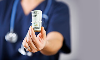 Nurse giving away money