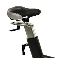 Fully adjustable saddle on Sunny Health & Fitness SF-B1714 Evolution Pro Indoor Cycle, adjusts up/down and forwards/backwards