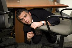 Man hides under desk
