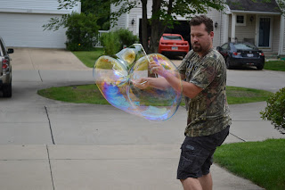 Dad attempting to make a giant bubble