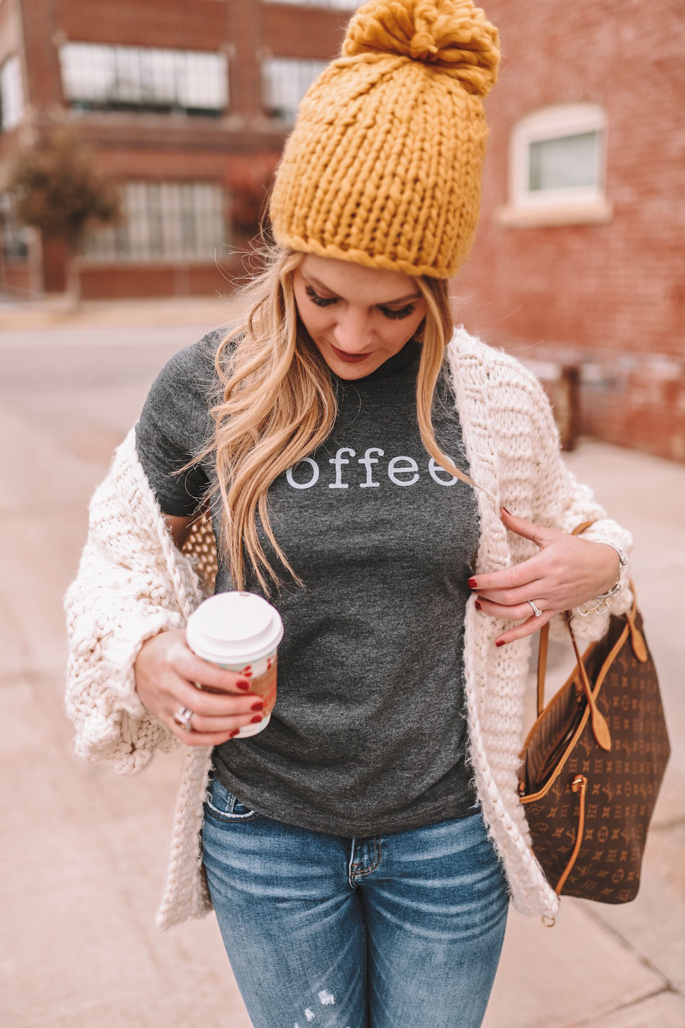 OKC blogger Amanda Martin cozied up in a chunky knit cardigan and a yellow pom knit beanie