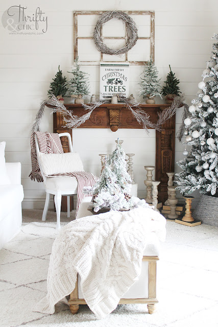 Christmas living room decor and decorating ideas. Farmhouse Christmas decor. Flocked Christmas trees. Shiplap wall and Christmas. Antique styled wood mantel. Wood mantel Christmas decor.