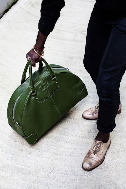 man with arch bowling bag