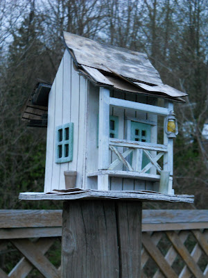 Bird house with broken roof