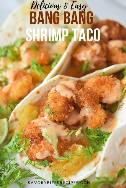 Very flavorful and restaurant style,Bang Bang Shrimp in a Taco,with easy homemade slaw and Thai sweet Chili and Sriracha Sauce,wrapped in a soft flour tortilla ready to be devoured to the last bit! #savorybitesrecipes #bangbangshrimptaco #bangbangshrimp #tacorecipe Bang Bang Shrimp Taco with slaw and sriracha sauce