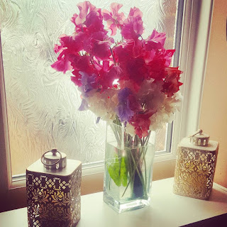 A balanced arrangement of Flowers and Lanterns