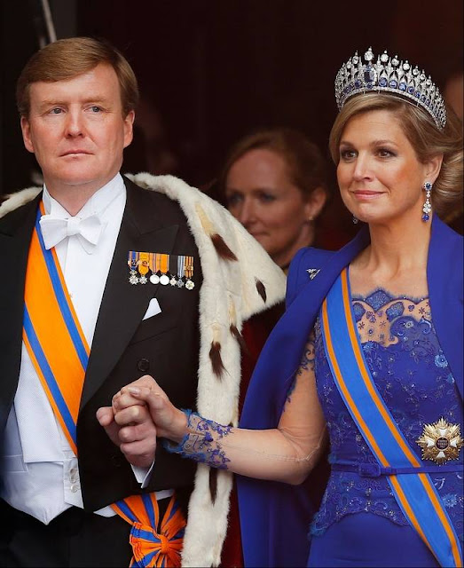 Dutch King Willem-Alexander is given three cheers by guests and his wife Queen Maxima inside the Nieuwe Kerk or New Church