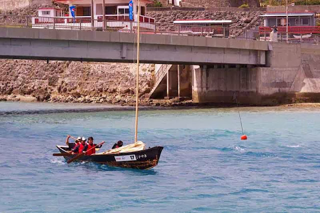 paddling a sailing sabani boat into wind