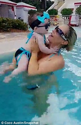 Coco Austin and daughter Chanel wear matching striped swimsuits on