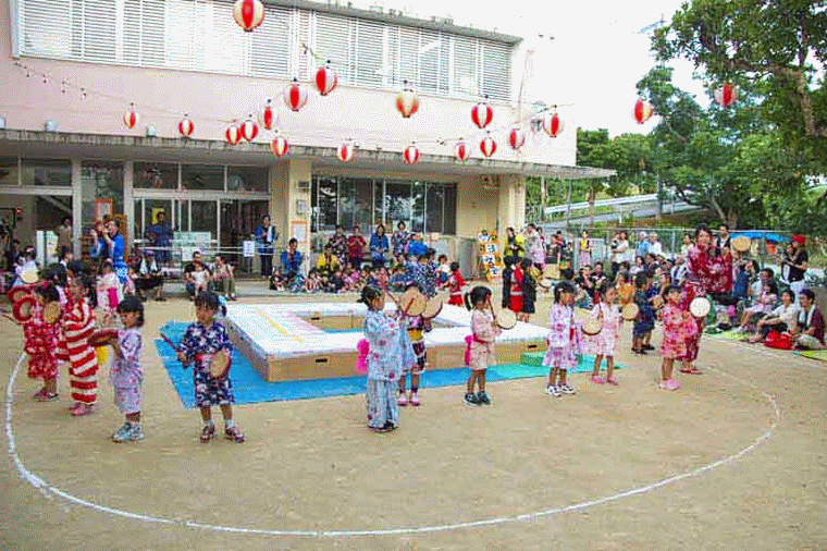 children Eisa dancing, outdoors, summer kimonos, teacher
