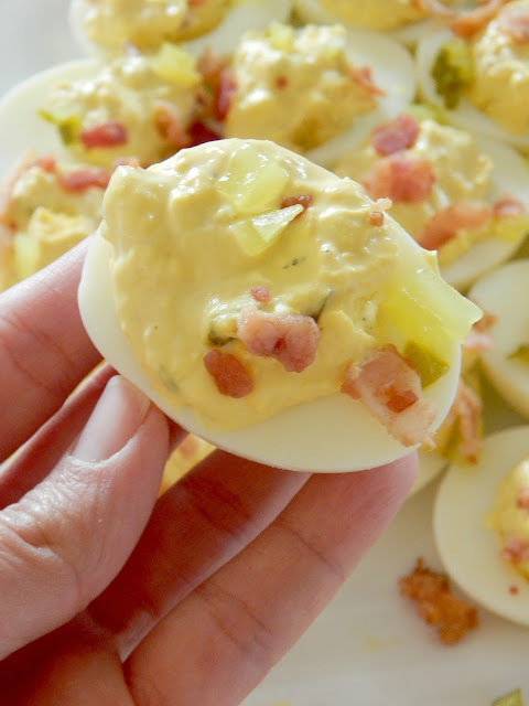 Dill Pickle & Bacon Deviled Eggs...the perfect way to use up those holiday boiled eggs!  Creamy, tangy, salty and down right delicious.  Makes 24 - they feed a crowd well. (sweetandsavoryfood.com)