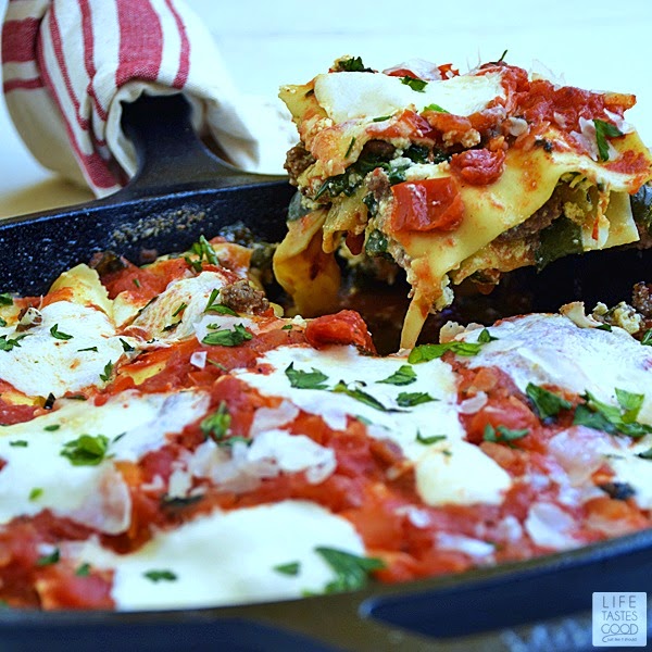 Cheesy Skillet Lasagna | by Life Tastes Good is so much easier to make than traditional lasagna, and it has all the same great tastes! I love all the fresh ingredients in this easy skillet lasagna. It is loaded with 3 different types of cheese, fresh tomatoes, spinach, and herbs for a satisfying meal the whole family will love!