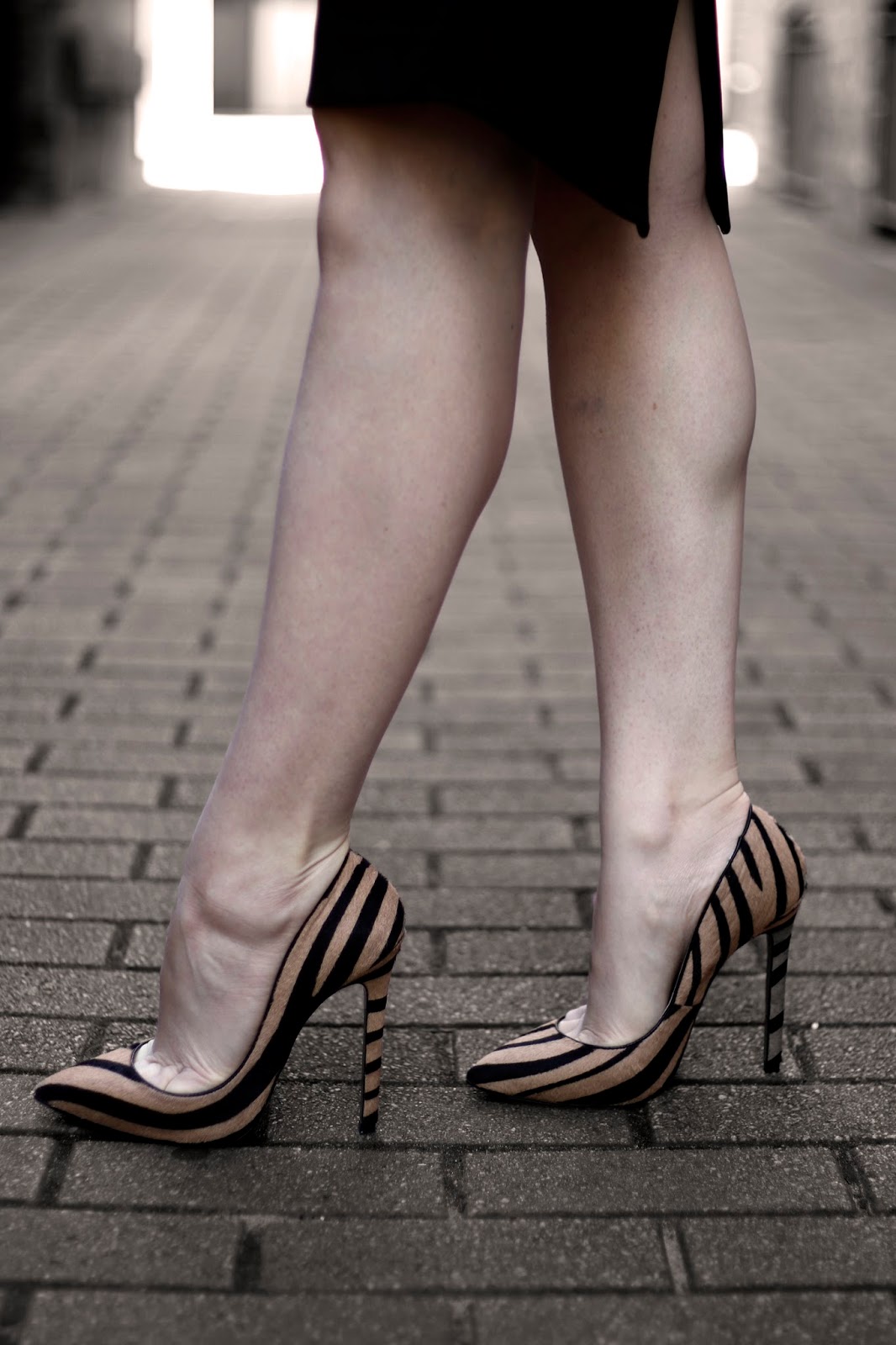 feet in high heel shoes