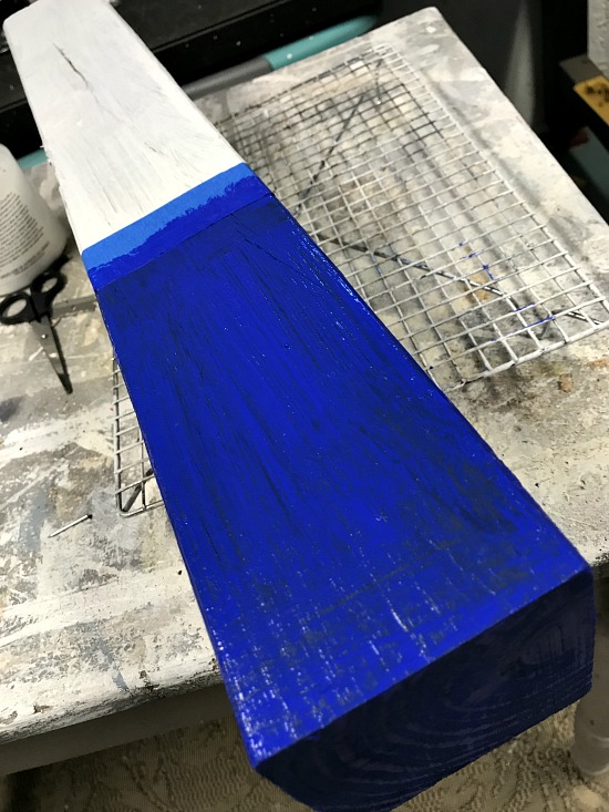wooden firecracker for the fourth of July painted blue