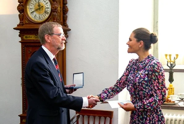 Crown Princess Victoria wore &Other stories floral print maxi dress, Merit Medals to Jonny Pettersson and Stefan Magnusson