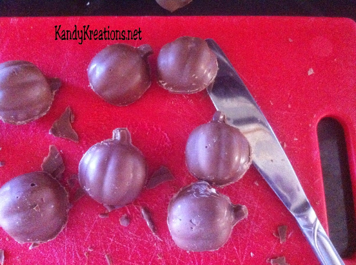 Celebrate Halloween with this sweet Pumpkin candy recipe.  These chocolate covered cherries are in the shape of pumpkins using a cheap dollar store mold and an easy candy recipe.  These chocolate candies are perfect for any fall holiday including Halloween and Thanksgiving, or just a more beautiful take on the store bough chocolate covered cherries.