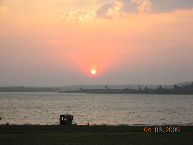 Sunset over Kabini river with boat