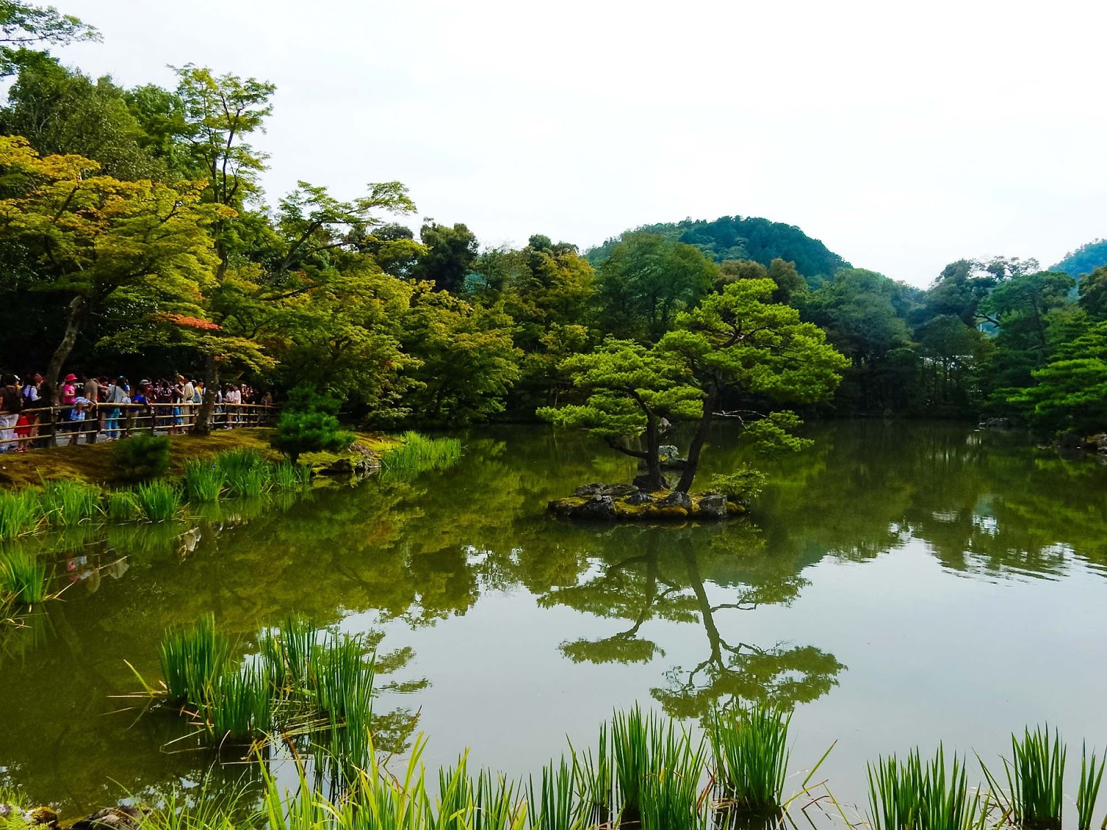 crowds at the grounds of kinkaku-ji temple