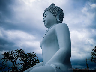 White Buddha Statue In The Dark Cloudy Weather At Buddhist Monastery Garden In Bali Indonesia