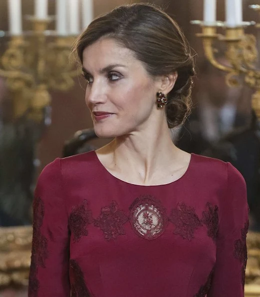 Queen Letizia attends the annual Foreign Ambassadors reception at the Royal Palace. Queen Letizia wore Felipe Varela Long sleeve dress in red. diamond earrings