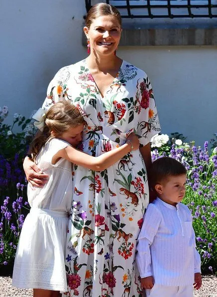 ASOS maxi dress with cape back and dipped hem in light floral print. Queen Silvia, Princess Estelle