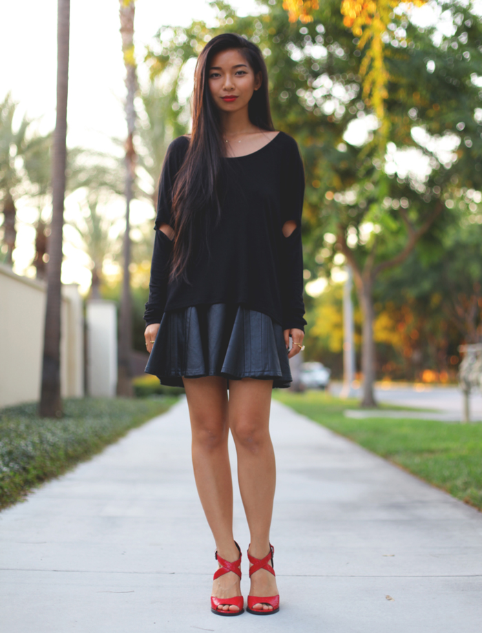 Stephanie Liu of Honey & Silk shares 3 ways to style red heels. The last look is an all-black mood in a Honey Punch shirt, Greylin leather skirt, Kitsch jewelry, and Kelsi Dagger Blanca heels
