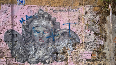 Street art on walls around central Palermo.